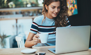 Lady on laptop in coffee shop