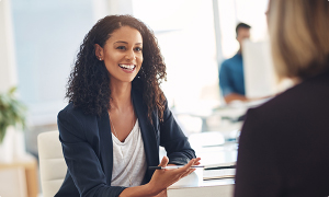 Two female coworkers having a conversation